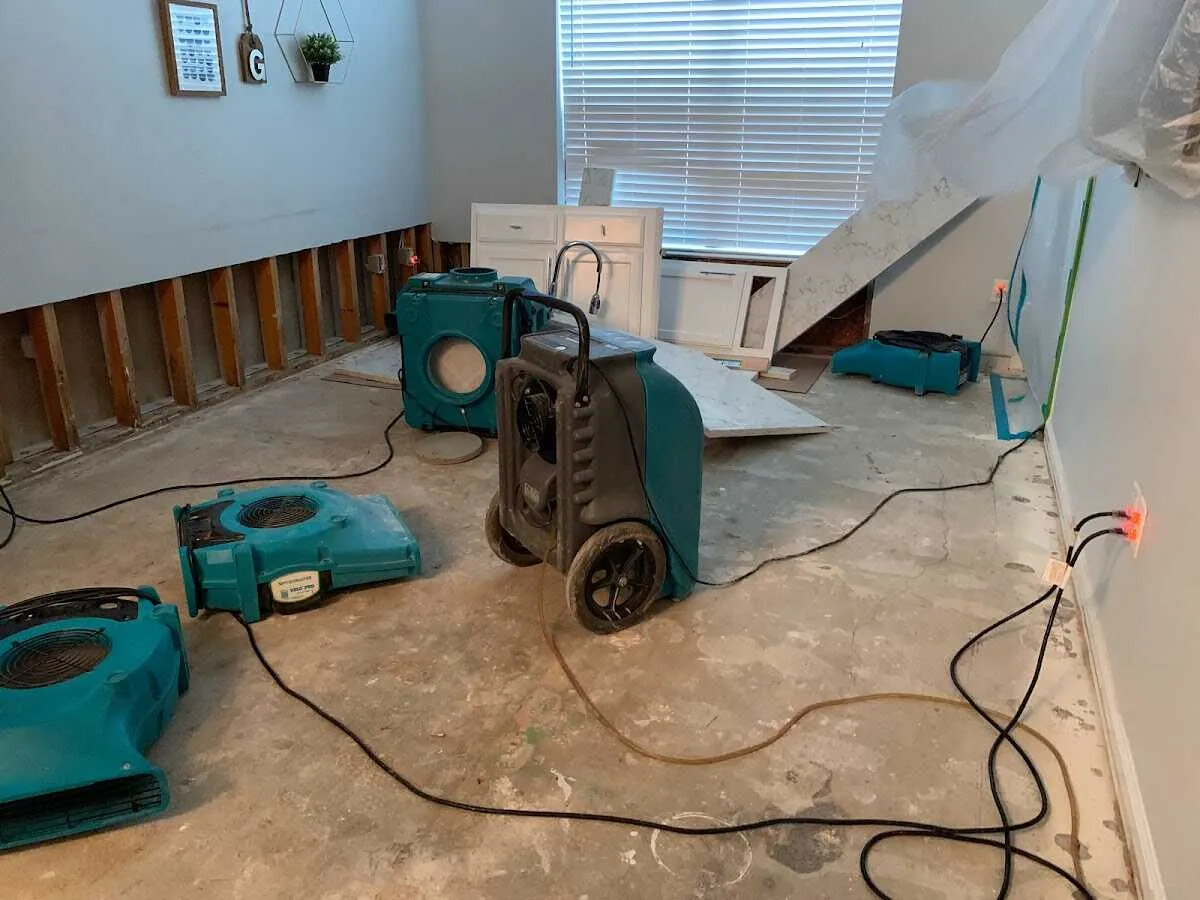 Dehumidifier in flood-cut room for Water Damage Restoration in Iowa Colony